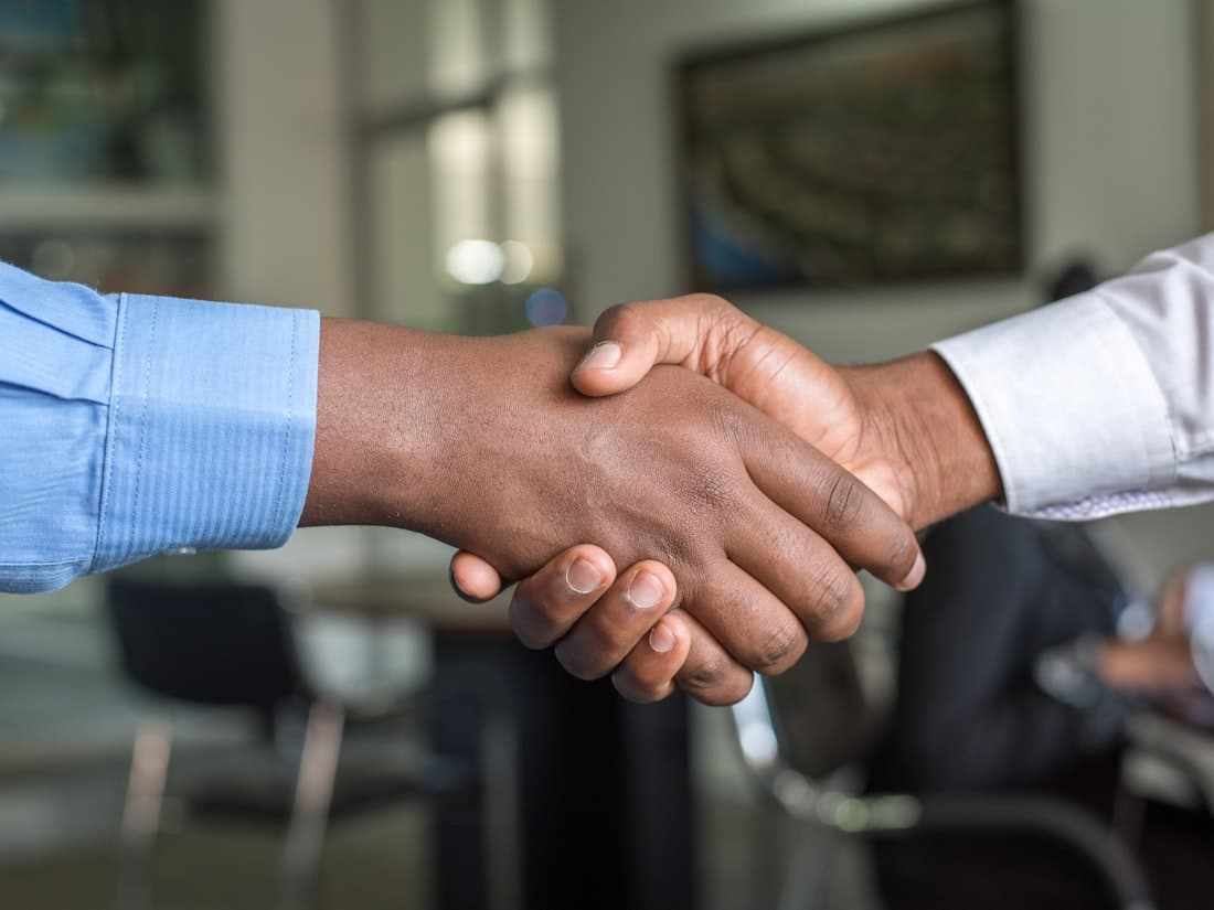 A handshake at the close of a successful interview